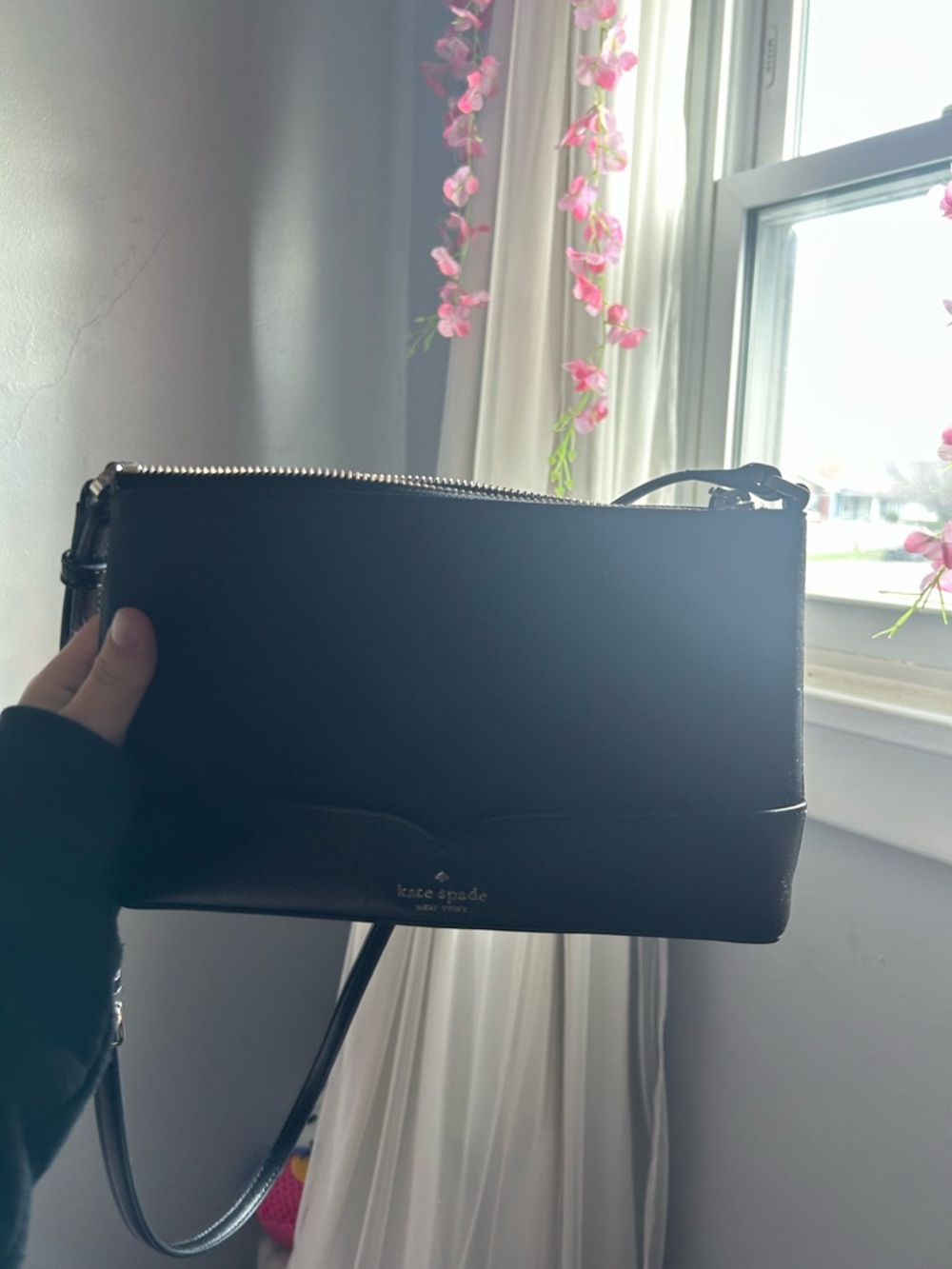 kate spade black interior wristlet with gold logo